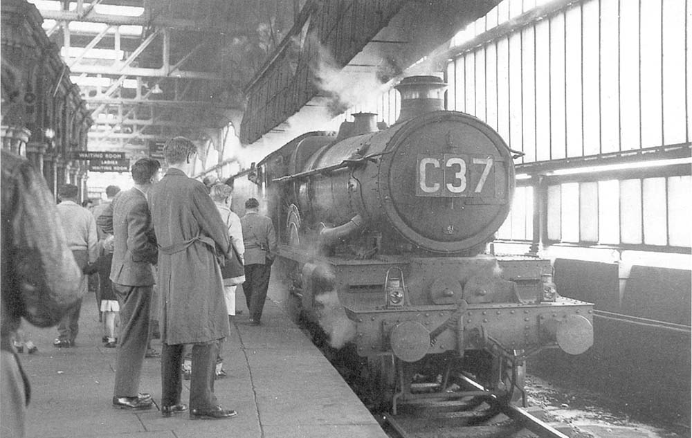 An unidentified ex-GWR 4-6-0 Castle class locomotive is seen standing at Platform 12 with a Class A service to the West Country
