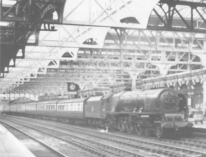 Ex-LMS 4-6-2 Princess Coronation class No 46237 'City of Bristol' is seen standing at Platform 7 on the 2 35pm Wolverhampton to Paddington service