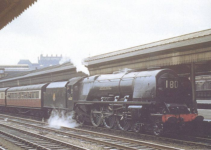 Ex-LMS 4-6-2 Princess Coronation class No 46237 'City of Bristol' is seen standing at Platform 6 on a down express service in May 1955