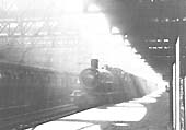 On a Saturday in August 1939 an unidentifiable GWR (Hall) class 4-6-0 waits to depart from down platform No 5
