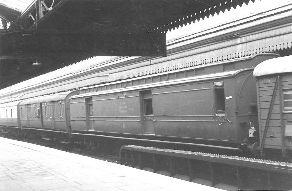 A 54 foot clerestory Parcel Brake Van with other parcels stock waits in bay platform No 10 in 1947