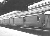 A 54 foot clerestory Parcel Brake Van with other parcels stock waits in bay platform No 10 in 1947