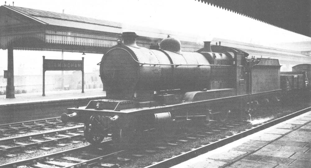 GWR 30xx (ROD) class 2-8-0 No 3033 on the down through main line with a class F on 4th October 1946