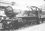 GWR Saint class 4-6-0 No 2947 �Madresfield Court� waits for an express on the central up main line track circa July 1912