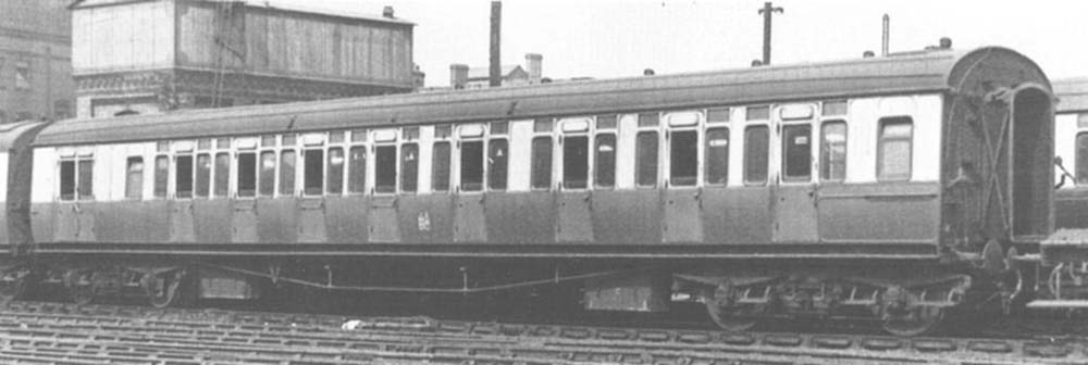 A GWR 70 ft Concertina brake composite coach in chocolate and cream livery, twin coat of arms device, as used between 1943 and 1946