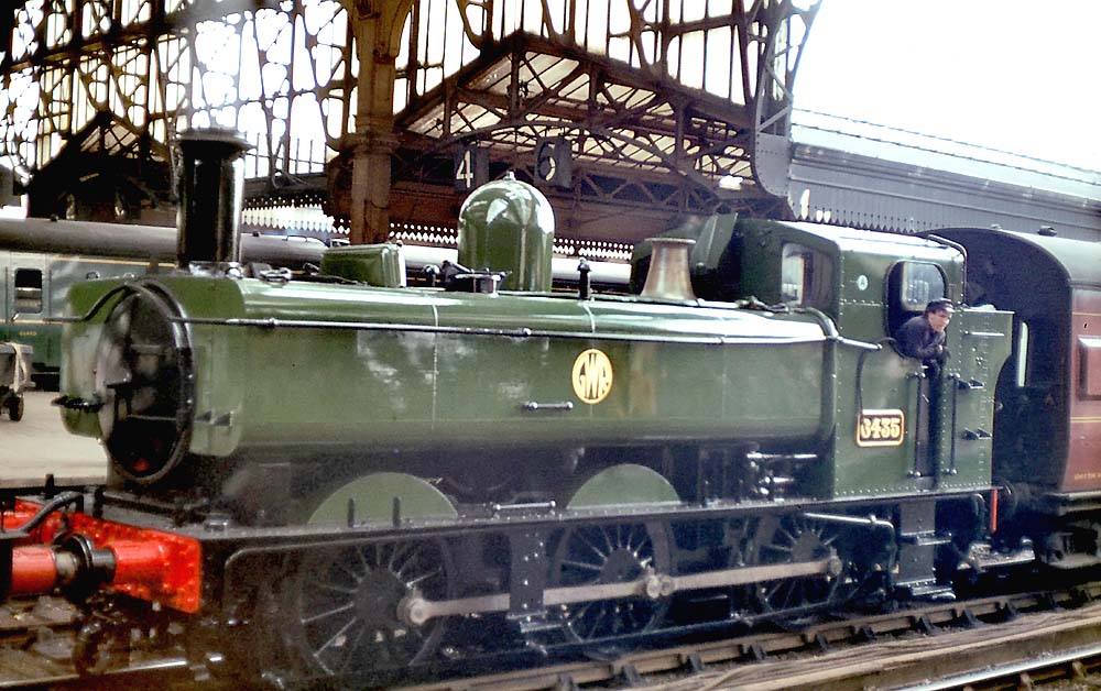 GWR 64xx class 0-6-0PT No 6435 is seen coupled to an SLS enthusiast's special on 24th April 1965