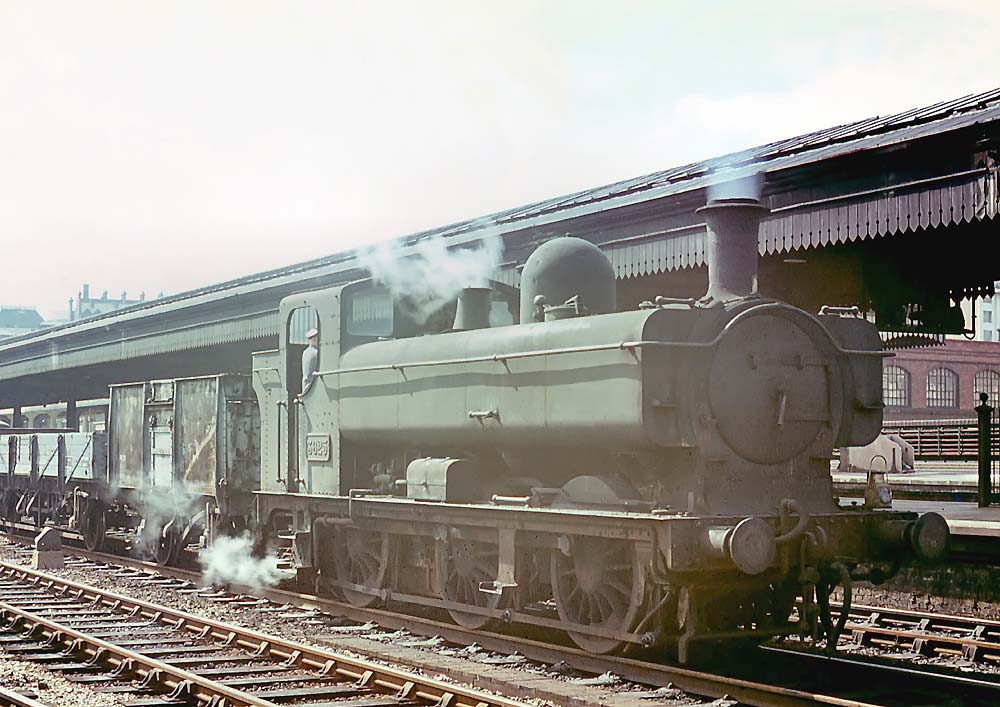 Ex-GWR 57xx class 0-6-0PT No 3625 is seen with a stopping freight train passing through Snow Hill on 9th June 1965