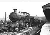 GWR 2-6-0 No 5370 with a down freight passes through the station on the main road on Saturday 5th June 1937
