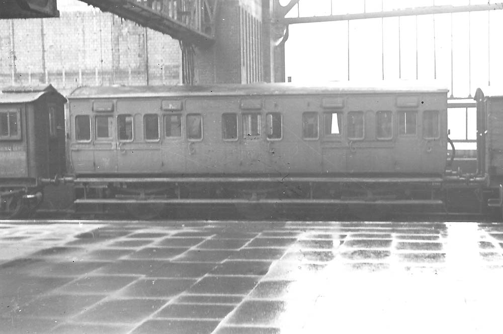 GWR six wheel Mess Van photographed adjacent to a Signal and Telegraph iron Workshop Van at Snow Hill Station in 1947
