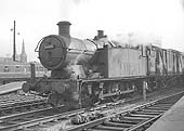 Ex-GWR 0-6-2T 56xx class No 6668 heads a Type 9 working through Birmingham Snow Hill station on 7th March 1964