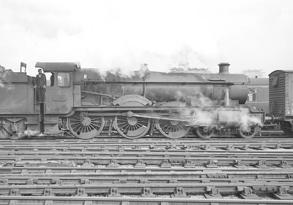 Ex-GWR 4-6-0 6959 class No 6971 'Athelhampton Hall' is seen on pilot duties at Snow Hill 7th March 1964