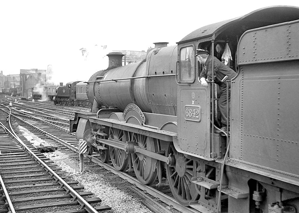 Ex-GWR 4-6-0 68xx class No 6842 'Nunhold Grange' stands at Snow Hill on a down service on 22nd August 1963
