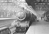 Ex-GWR 4-6-0 Hall class No 5959 'Mawley Hall' is seen standing at Platform 5 whilst at the head of a down semi-fast express service