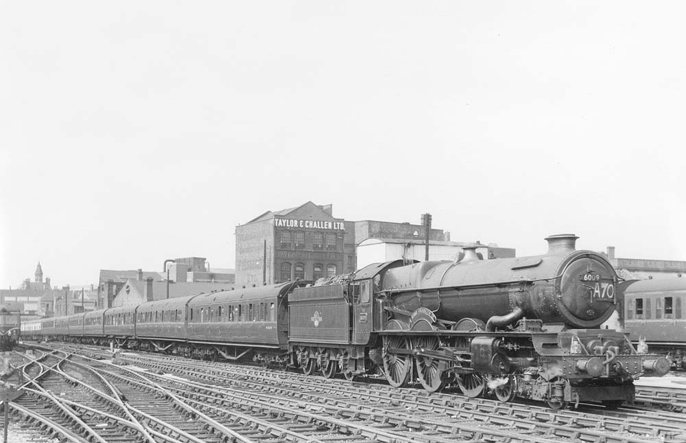 Ex-GWR 4-6-0 King class No 6009 King Charles II is seen approaching Platform 7 at the head of an up express service from Birkenhead to Paddington