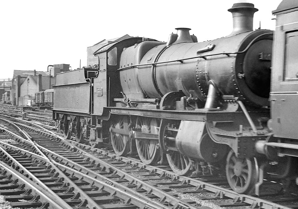 Ex-GWR 43xx class 2-6-0 No 6364 runs tender first with empty coaching stock on 17th April 1964
