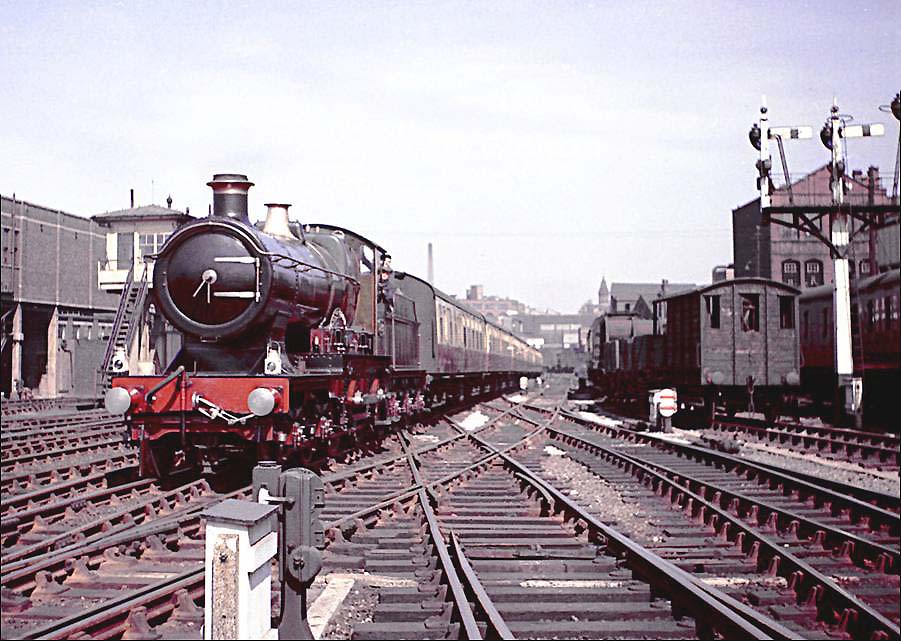 Ex-GWR 4-4-0 No 3440 'City of Truro' approaches Birmingham Snow Hill with an excursion to Swindon on 16th June 1957