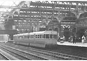 A three-car, four wheel ACV Lightweight Diesel Unit standing at Snow Hill station's Platform 5 with a local service