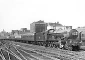 British Railways built Castle class No 7037 'Swindon', the last member of the class to be built, is seen entering Platform 7 at the head of an up Class A express service