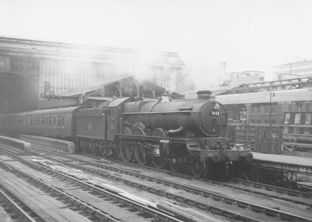 British Railways built 4-6-0 Castle class No 7032 'Denbigh Castle' is seen standing at Platform 5 with a down Class B local stopping train to Wolverhampton