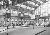 A 1960s view of the Concourse showing advertising hoardings around the glass roof and car parking bays in the driveway area
