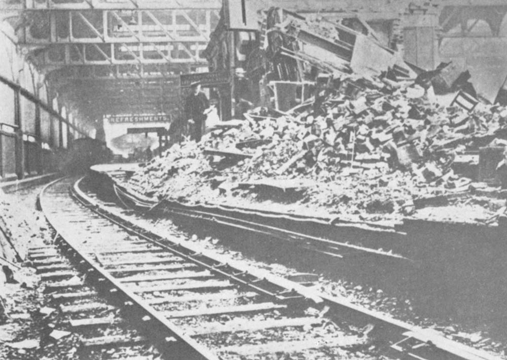 View of the damage to the buildings on Platform 1 showing the ladies waiting room and the book stall which had been completely destroyed in the air raid
