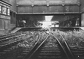 View of the near derelict station looking along the main through roads of Snow Hill station towards Wolverhampton with weeds growing through the tracks