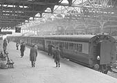 View of a six-coach DMU strengthened by the addition of standard coach at the rear on the 5 40pm service to Cardiff General in June 1958