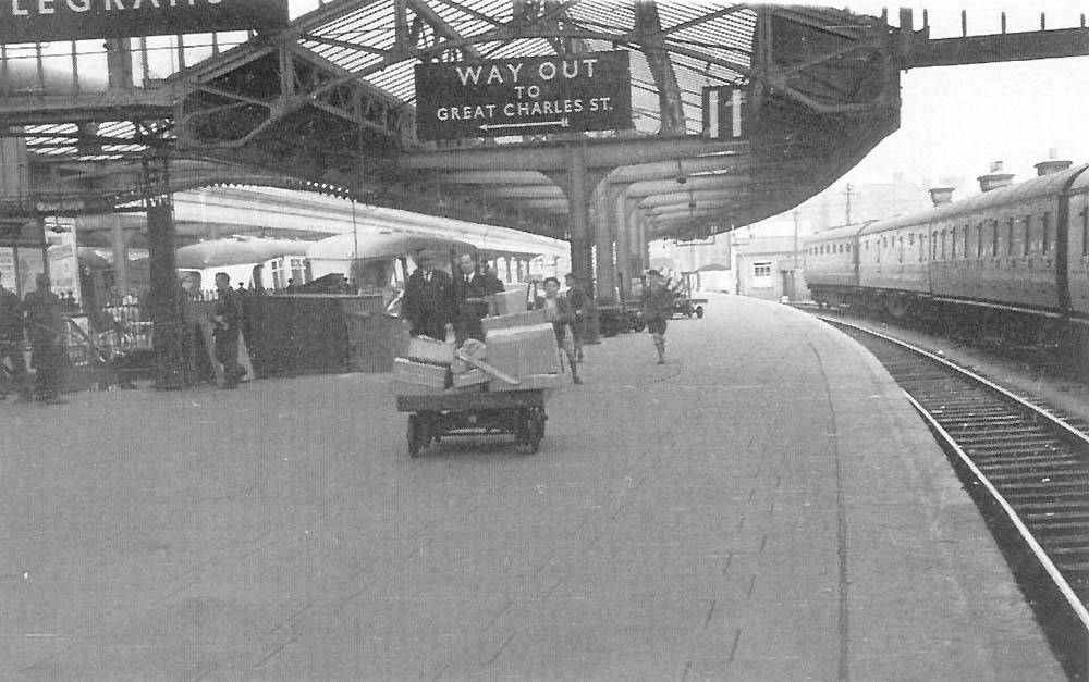 View of Platform 11 looking towards Wolverhampton with two Railcars standing in the bay platforms 9 and 10 on the left