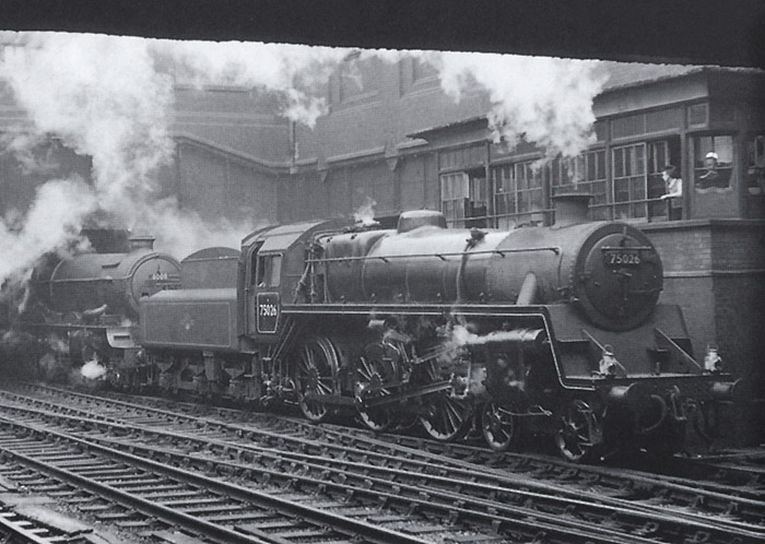View of Snow Hill station's South Signal Box as British Railways Standard Class 4 4-6-0 No 75026 enters the station on 2nd May 1959