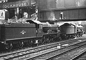 A pair of ex-GWR 4-6-0 Castle class locomotives, No 5040 'Stokesay Castle and No 5049 'Earl of Plymouth' are seen standing under the footbridge