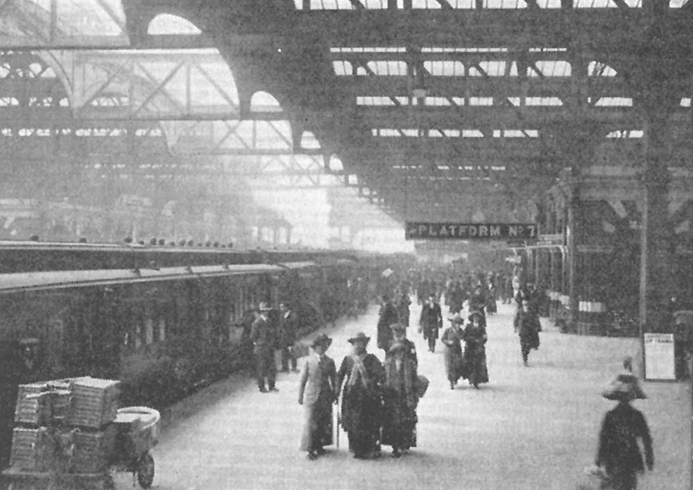 An Edwardian view of the up main platform as passengers disembark from an express comprised of Clerestory coaching stock