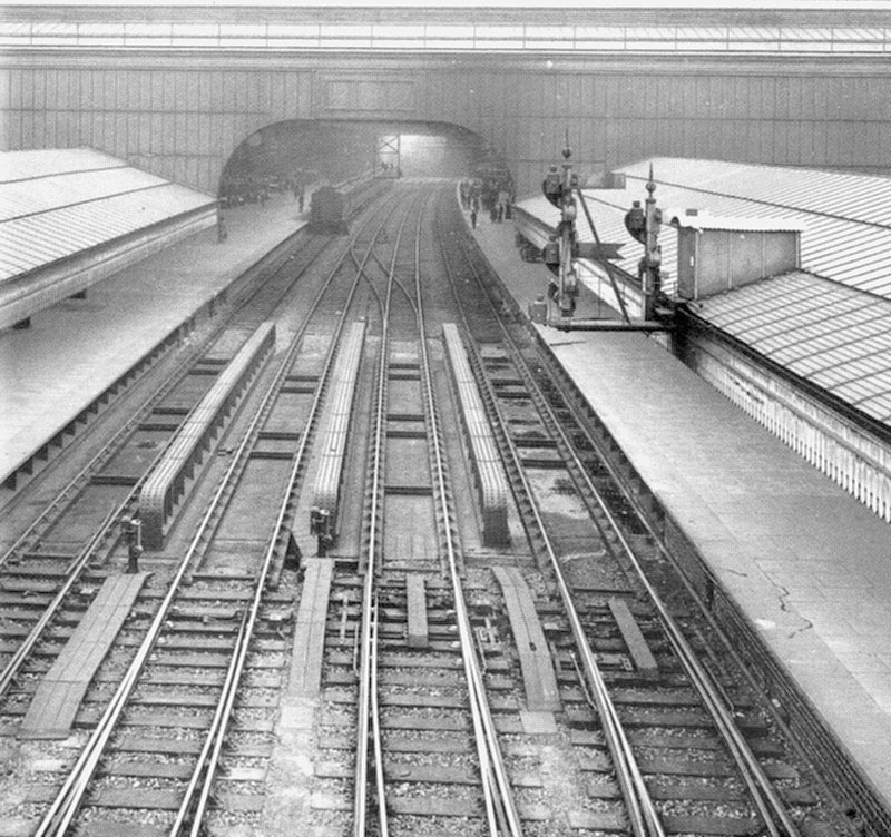 View of main tracks through Birmingham Snow Hill station from above the central scissor cross-over switch junctions
