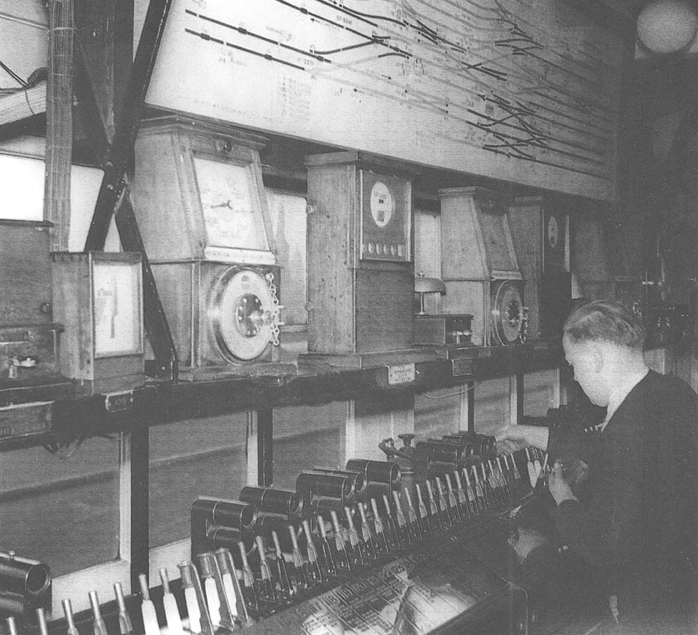 Signalman carries out operations to set the route of an up train on the electric power frame at Birmingham North Signal Box in 1957