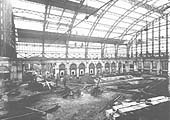 The vast new booking hall under construction in 1911 and the ornate porticos for the ticket issuing windows