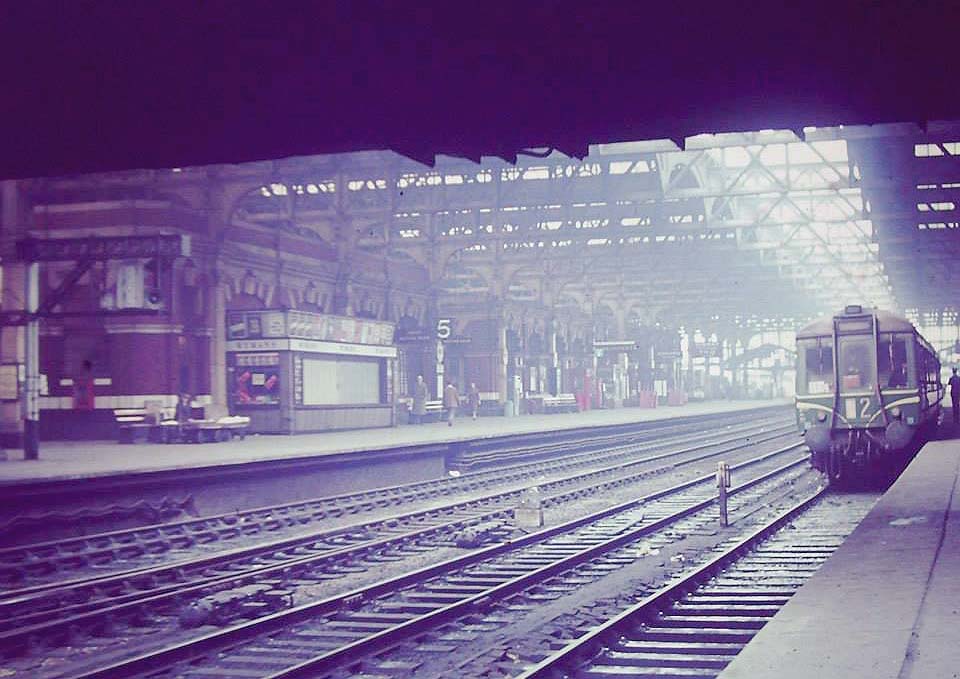 A British Railways single car Diesel Multiple Unit stands at Platform 7 with a service to Stourbridge in 1964