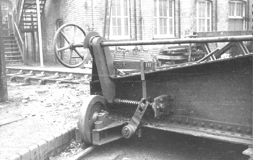 Close up showing one end of the over-girder bridge of the turntable with the water tank building behind