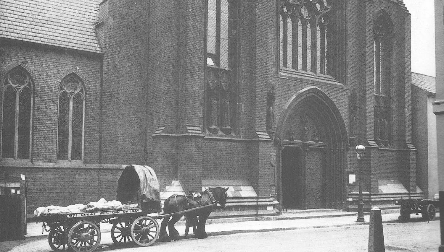 Great Western Railway single horse flat trolley No 971 loaded with several carcasses outside St Chads Roman Catholic Cathedral