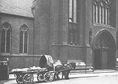 GWR single horse flat trolley No 971 loaded with several carcasses outside St Chads Cathedral