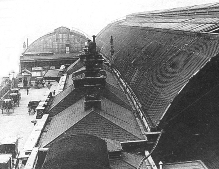 Close up showing the buildings containing the offices and passenger facilities and in the distance the rear of the train shed covering the bay platforms