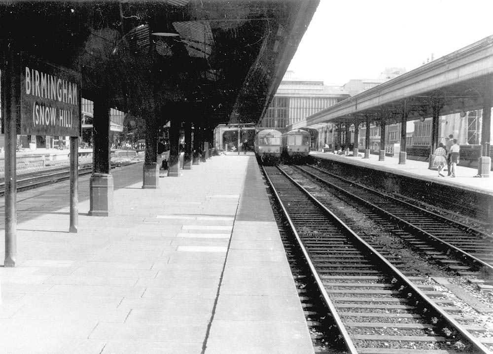 Looking along bay Platforms 4 and 5 with two different classes of Diesel Multiple Units standing at the buffer stops