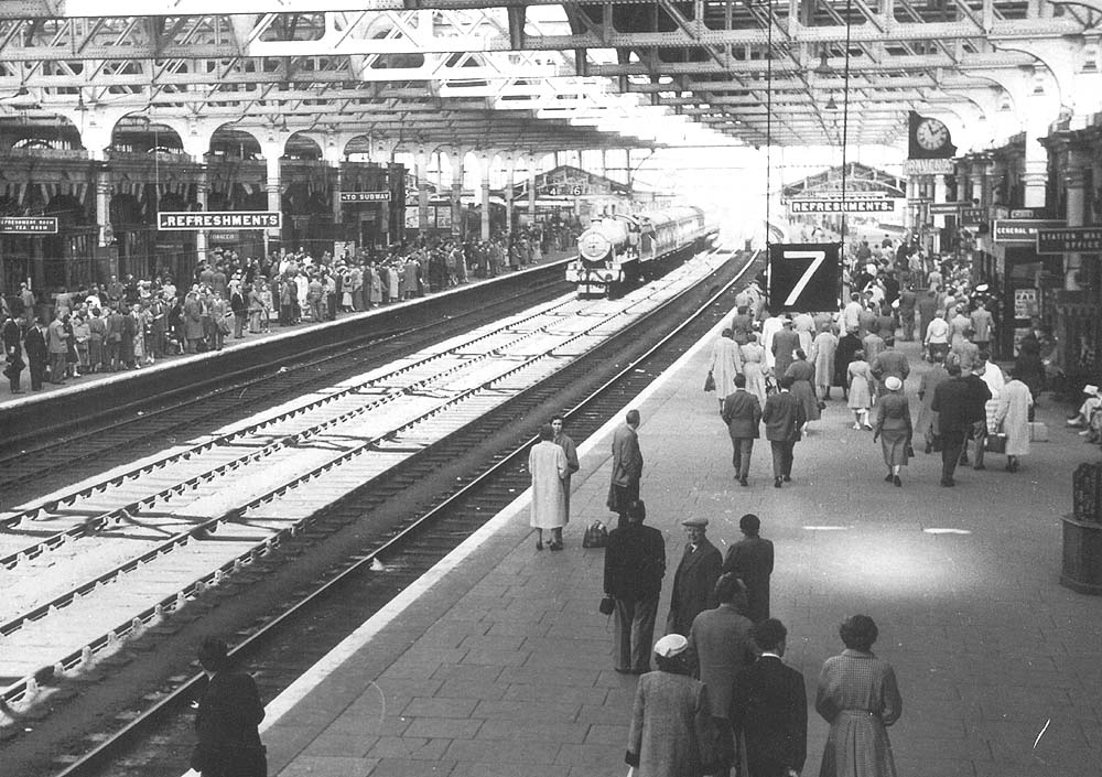 Looking towards Hockley along the main up platform as an up express passes through the station on the 'down' middle road