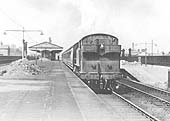 An unidentified ex-GWR 2-6-2T 'Prairie' locomotive runs bunker first with a Class B local passenger service