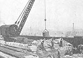 A six ton steam crane removes old brickwork during the partial reconstruction of Bordesley Viaduct in 1939