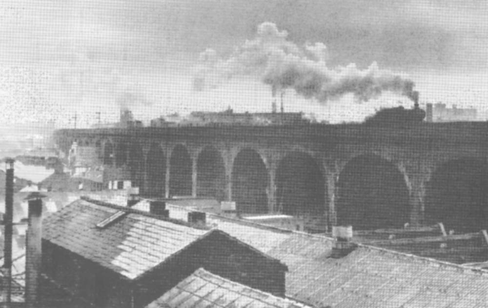 View showing the northern elevation of the viaduct with a Prairie tank on the down main line with a north bound freight