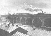 View showing the northern elevation of the viaduct with a Prairie tank on the down main line with a north bound freight