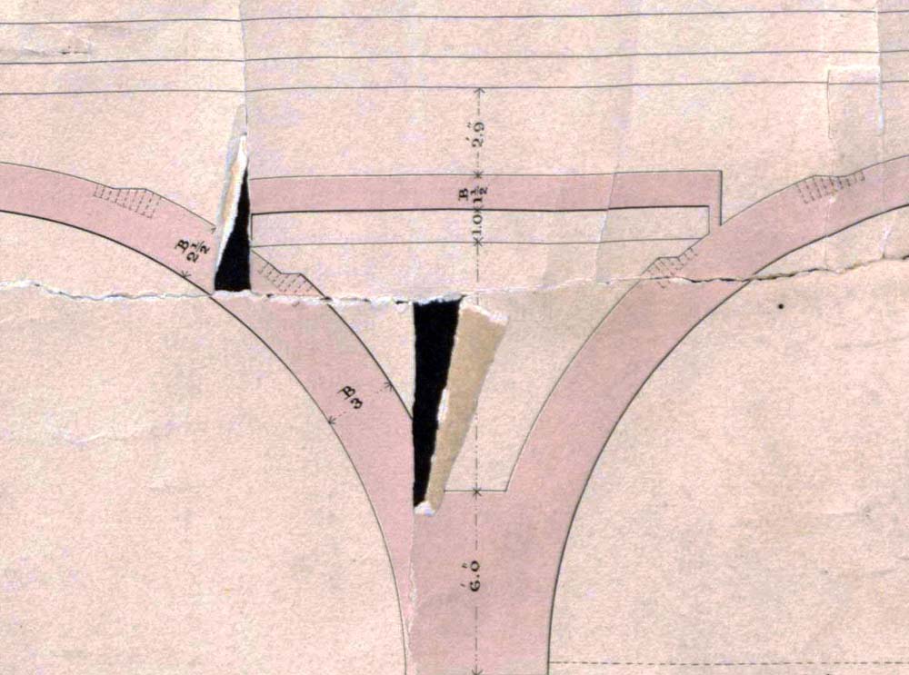 Close up showing an 18" thick masonry slab running between the spandrel walls at Alcock Street bridge