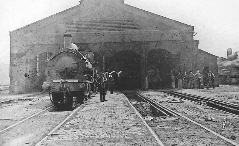 Photograph showing the Birmingham end of Bordesley engine shed with a locomotive standing over one of the ash pits