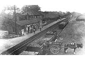 Coal being unloaded from a Private Owner wagon into the horse drawn cart on Claverdon's loading bank