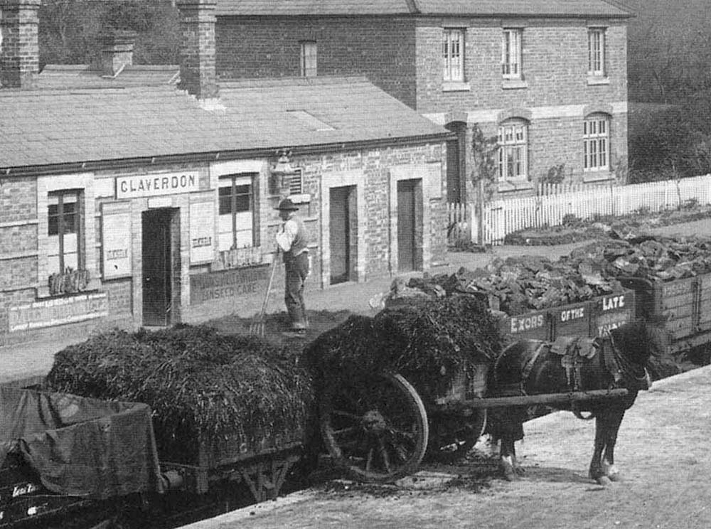 Close up of the unloading of manure from a GW open wagon on to a two wheel cart on the wharf