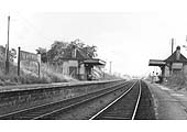 Looking along the 1930s replacement station platforms from beneath the road bridge towards Bearley